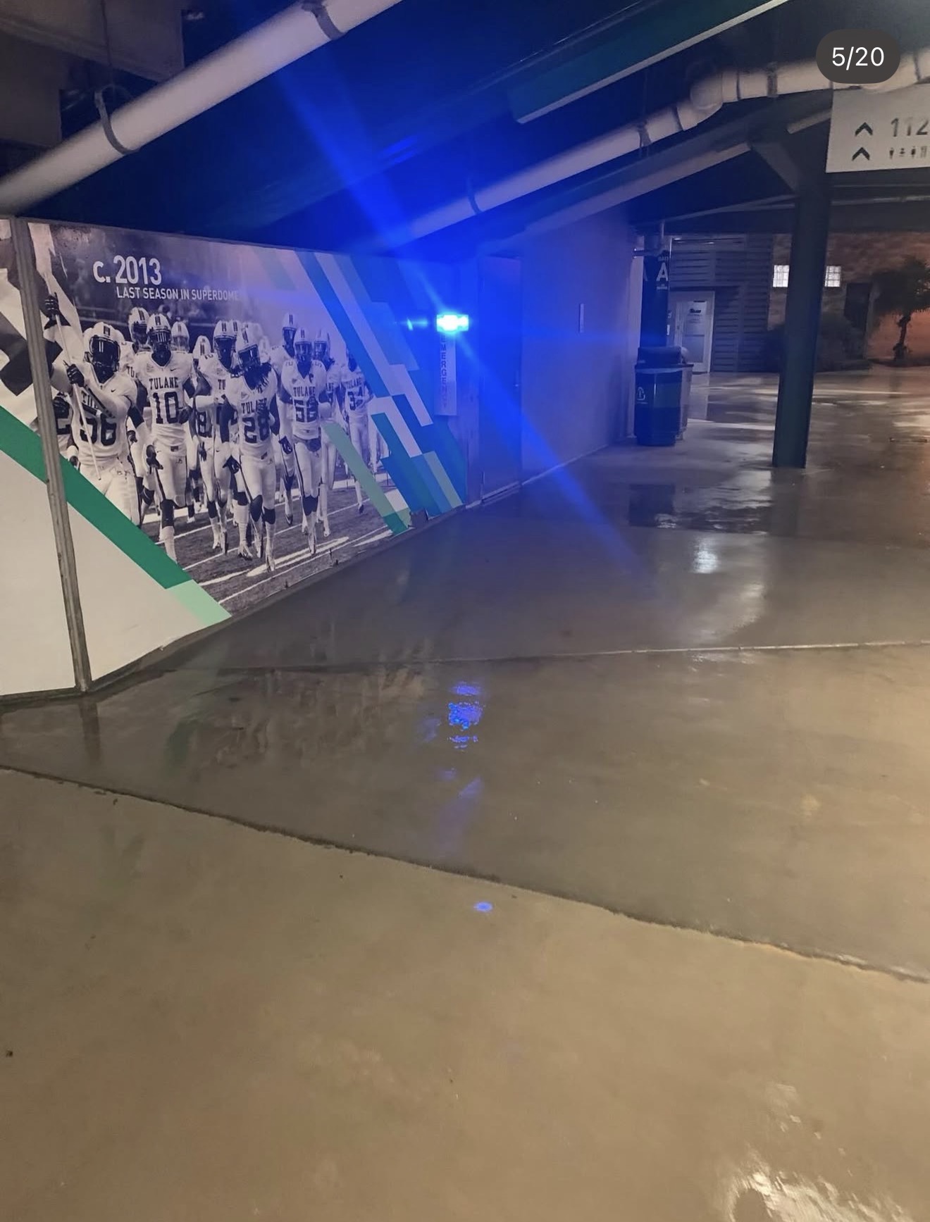Washed stadium corridor with Tulane team mural